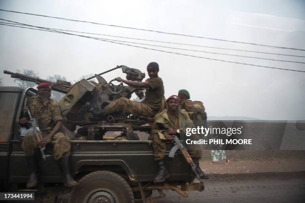 Photo taken through a car window shows a group of Congolese army soldiers driving out of Goma in the east of the Democratic Republic of the Congo on...
