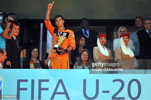 Uruguayan goalkeeper Guillermo De Amores gestures as he poses with the Golden Golve award after the FIFA Under 20 World Cup final football match...