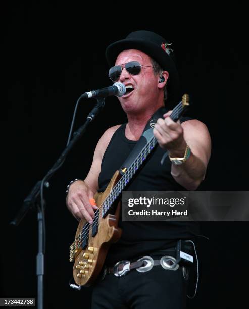 Mark King of Level 42 performs on stage at Magic Summer Live Festival 2013 at Stoke Park on July 14, 2013 in Guildford, England.