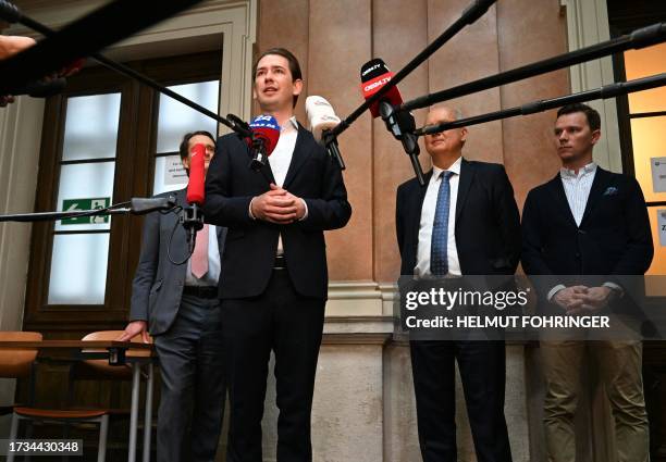 Austria's former chancellor Sebastian Kurz talks to journalists at the state court in Vienna, Austria, on October 20 as he arrives for his trial....