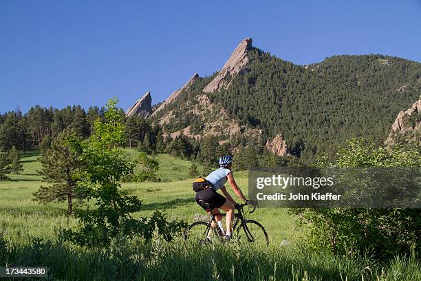 woman biking at chautauqua park - boulder colorado stock pictures, royalty-free photos & images