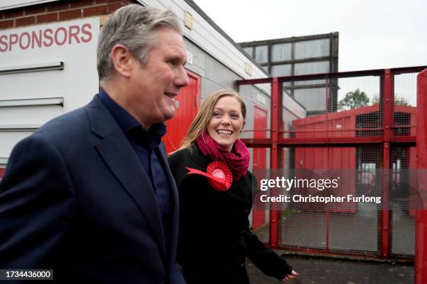 Labour candidate Sarah Edwards smiles as she walks next to Labour Party leader Keir Starmer after winning the Tamworth by-election on October 20,...