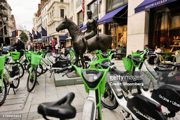 Electric hire bikes, operated by Lime Technologies AB, outside the Ralph Lauren Corp. Store in central London, UK, on Thursday, Oct. 19, 2023. Retail...