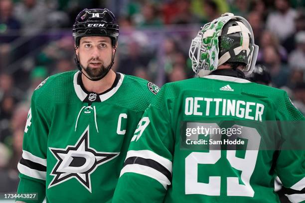 Jamie Benn of the Dallas Stars and Jake Oettinger talk during the second period against the St. Louis Blues in the season opening game at American...