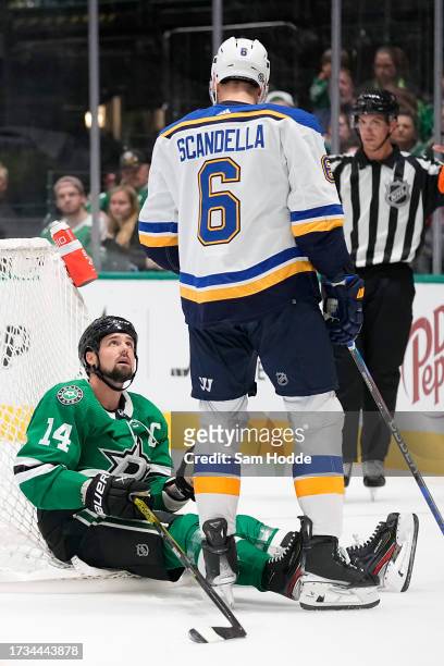 Jamie Benn of the Dallas Stars looks up at Marco Scandella of the St. Louis Blues after being knocked down during the second period in the season...