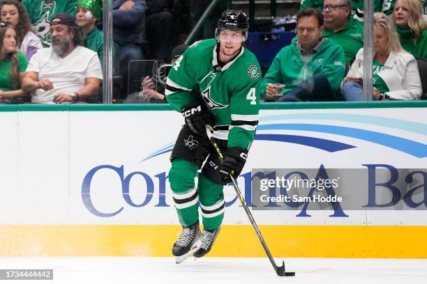 Miro Heiskanen of the Dallas Stars skates with the puck during the second period against the St. Louis Blues in the season opening game at American...