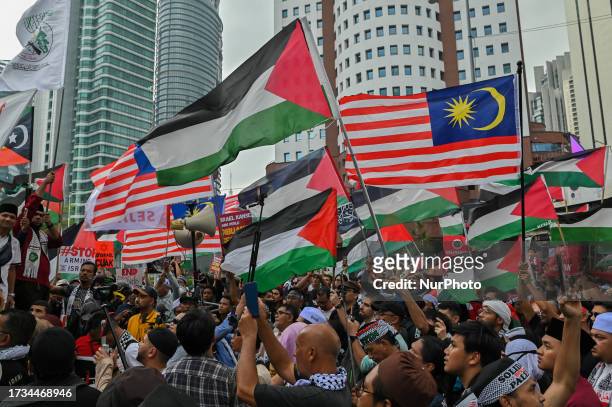 Hundreds of Muslim activists gather to protest in solidarity in the wake of the conflict between Israel and Hamas in the Gaza Strip outside the US...
