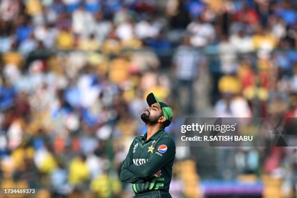 Pakistan's captain Babar Azam reacts while fielding during the 2023 ICC Men's Cricket World Cup one-day international match between Australia and...
