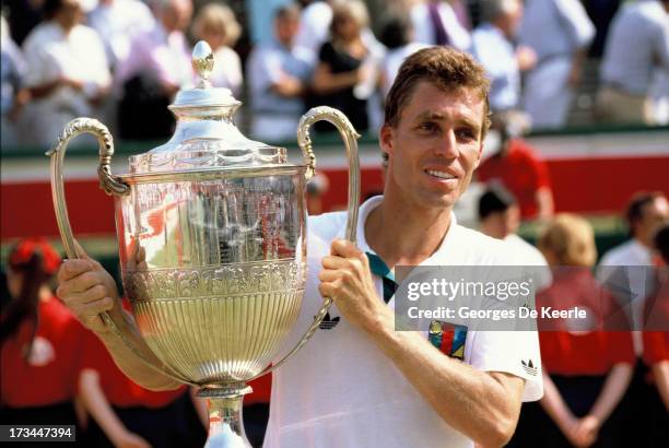 Tennis player Ivan Lendl rises his trophy after winning the Stella Artois Championships held at the Queen's Club on June 18, 1989 in London, England.