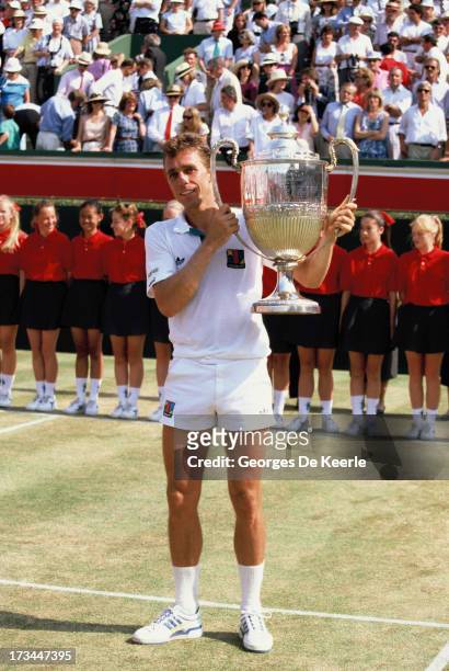 Tennis player Ivan Lendl rises his trophy after winning the Stella Artois Championships held at the Queen's Club on June 18, 1989 in London, England.
