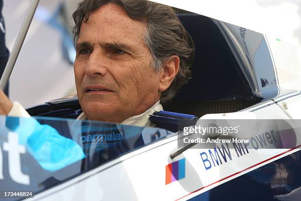 Former F1 World Champion Nelson Piquet sits in the cockpit of the Brabham BT52 from 1983 as he takes part in the Goodwood Festival of Speed on July...