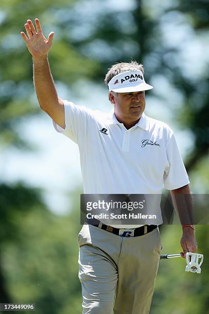 Kenny Perry celebrates a birdie putt on the second green during the final round of the 2013 U.S. Senior Open Championship at Omaha Country Club on...