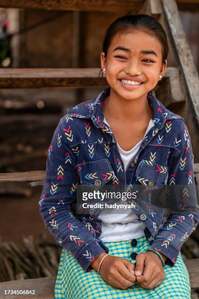 laotian little girl in a village in northern laos - laos stockfoto's en -beelden