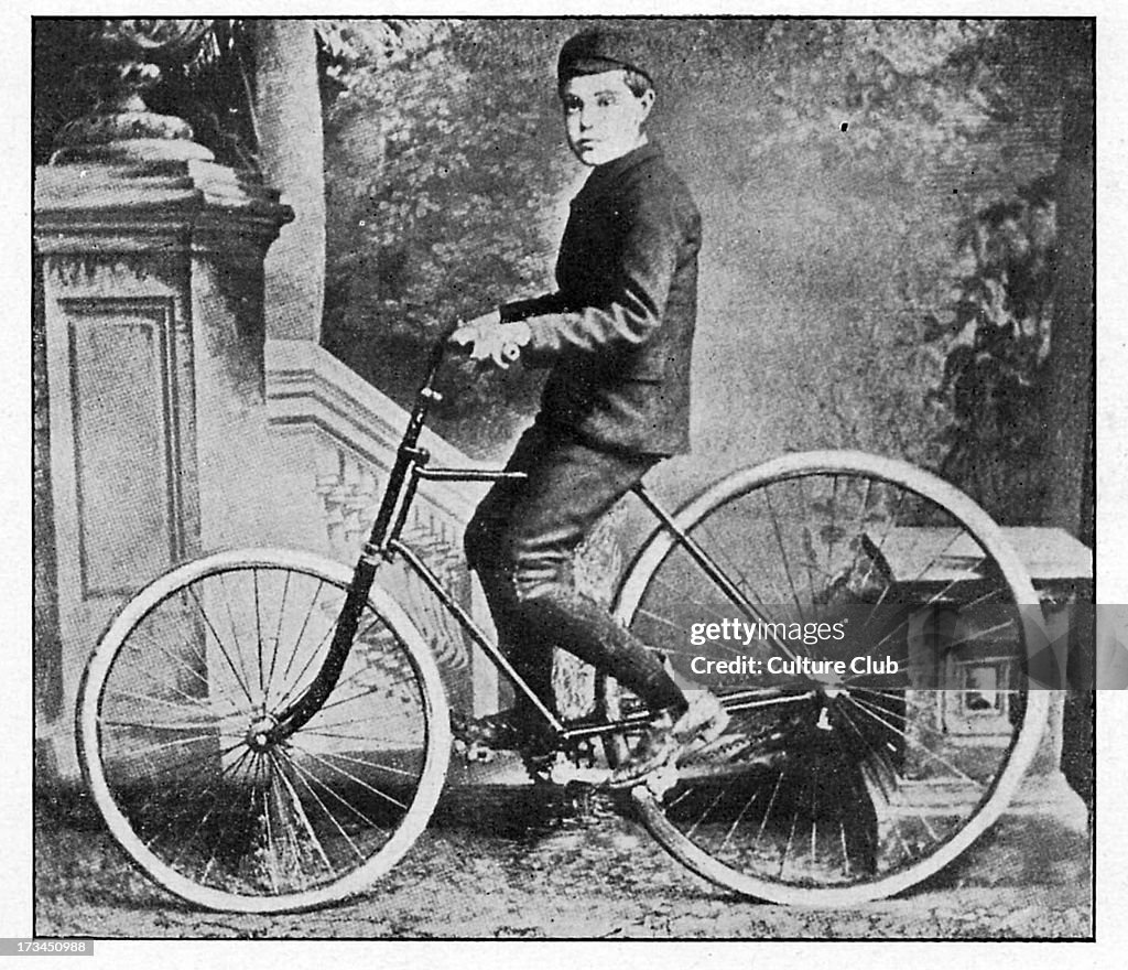 The son of Dunlop riding the first bicycle with inflatable
