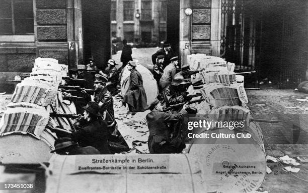 Street battles in Berlin - Spartacists behind a two - way barricade. During Spartacist Uprising of German Revolution of November 1918 Spartacus...