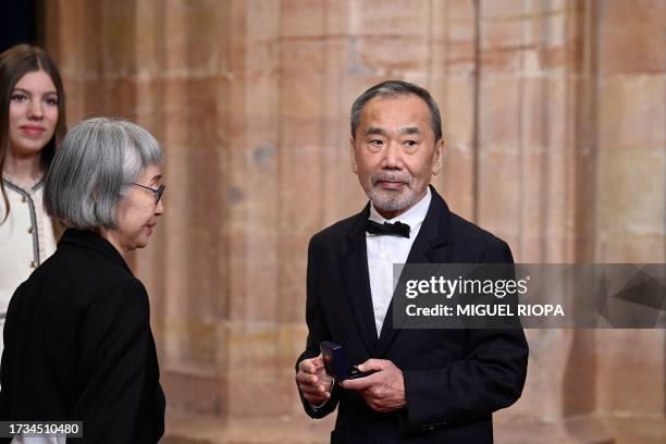 Japanese writer Haruki Murakami looks on after receiving a medal ahead of the 2023 Princess of Asturias award ceremony at the Campoamor theatre in...