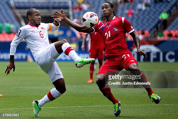 Julian De Guzman of Canada battles for the ball with Richard Dixon of Panama during the first half of a CONCACAF Gold Cup match at Sports Authority...