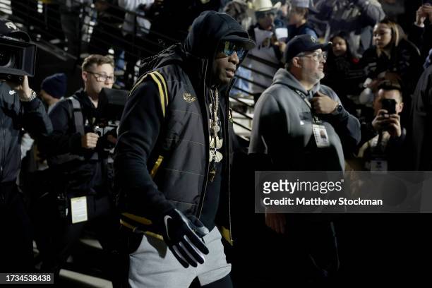 Head coach Deion Sanders of the Colorado Buffaloes takes the field for pregame against the Stanford Cardinal at Folsom Field on October 13, 2023 in...