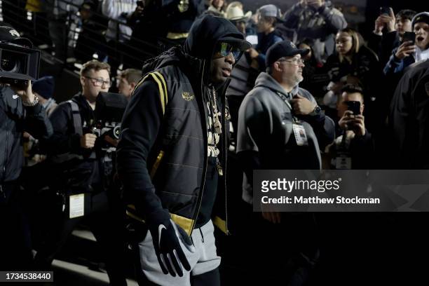 Head coach Deion Sanders of the Colorado Buffaloes takes the field for pregame against the Stanford Cardinal at Folsom Field on October 13, 2023 in...