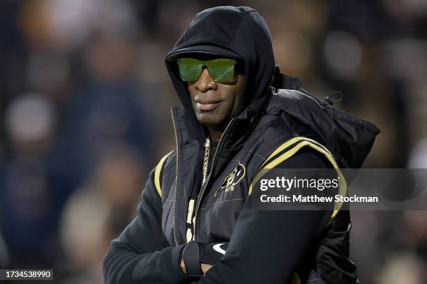 Head coach Deion Sanders of the Colorado Buffaloes walks on the field during pregame against the Stanford Cardinal at Folsom Field on October 13,...