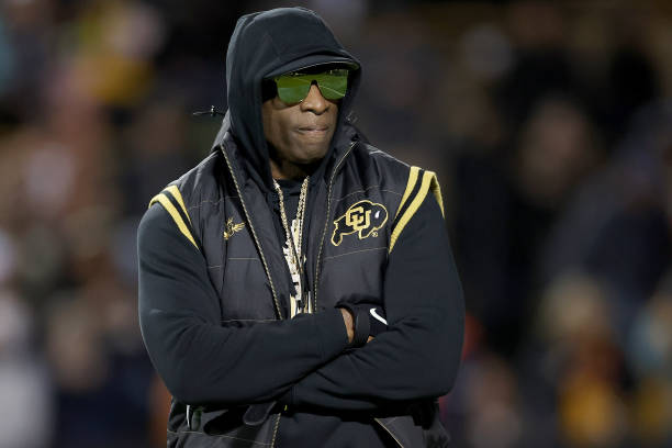 Head coach Deion Sanders of the Colorado Buffaloes walks on the field during pregame against the Stanford Cardinal at Folsom Field on October 13,...