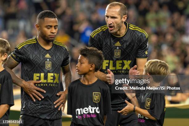 Giorgio Chiellini and Diego Palacios ##12 of LAFC with player escort during a game between Minnesota United FC and Los Angeles FC at BMO Stadium on...