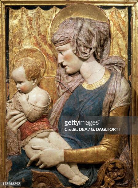 Virgin and Child, ca 1440, by Donatello , painted and gilded terracotta relief, 102x74 cm. Italy, 15th century. Paris, Musée Du Louvre