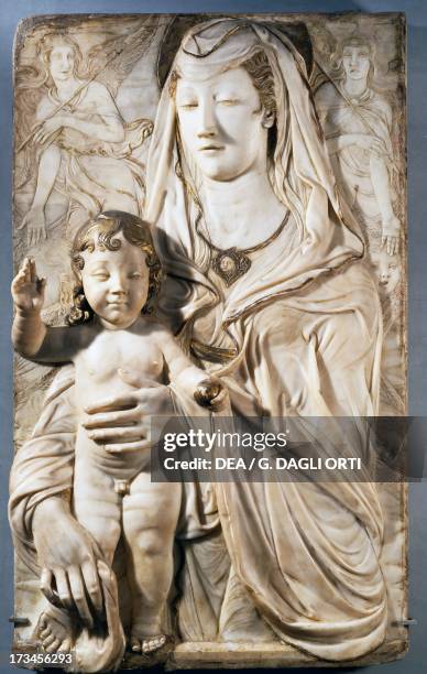 Virgin and Child with angels, by Agostino di Duccio , marble relief, 91x77 cm, Castle of Rignano Spinelli. Italy, 15th century. Paris, Musée Du Louvre