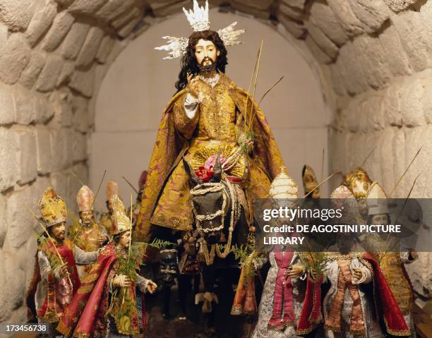 Entry of Christ into Jerusalem surrounded by eleven apostles in bishop's robes, statues from the Procession, Colonial Art , Peru. Cuzco, Museo Del...