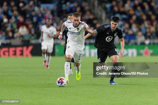 Tyler Boyd of LA Galaxy is chased down by Miguel Tapias of Minnesota United FC during a game between Los Angeles FC and Minnesota United FC at...