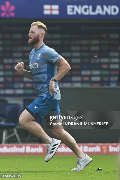 England's Ben Stokes jogs during a training session at the Wankhede stadium in Mumbai on October 20, 2023 ahead of their 2023 ICC Men's Cricket World...