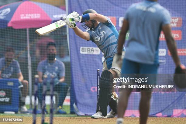 England's Joss Butler plays a shot during a training session at the Wankhede stadium in Mumbai on October 20, 2023 ahead of their 2023 ICC Men's...