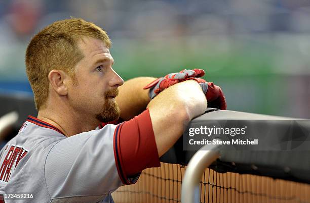 Chad Tracy of the Washington Nationals looks on from the dugout during the seventh inning against the Miami Marlins at Marlins Park on July 14, 2013...