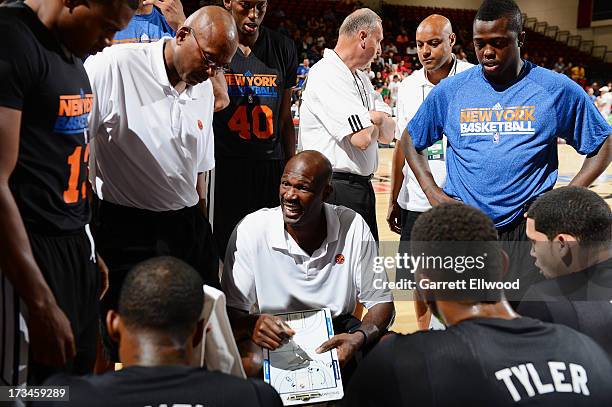 Herb Williams, assistant coach of the New York Knicks, directs his team in a timeout against the Washington Wizards during NBA Summer League on July...