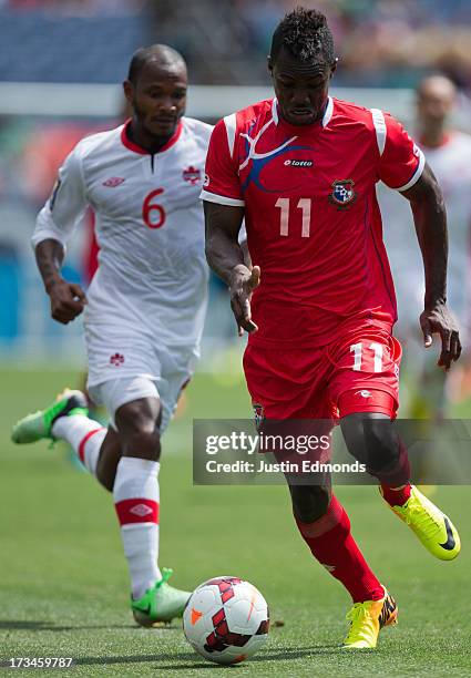 Cecilio Waterman of Panama dribbles the ball past Julian De Guzman of Canada during the second half of a CONCACAF Gold Cup match at Sports Authority...