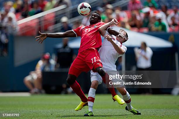Cecilio Waterman of Panama tries to control the ball with his chest away from Nikolas Ledgerwood of Canada during the second half of a CONCACAF Gold...