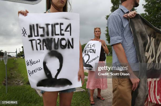 Demonstrators protest the George Zimmerman verdict in front of the Seminole County Criminal Justice Center on July 14, 2013 in Sanford, Florida....