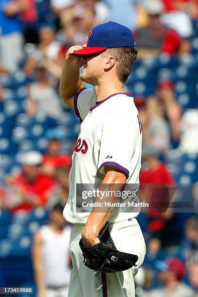 Closer Jonathan Papelbon of the Philadelphia Phillies reacts after giving up the tying run in the ninth inning during a game against the Chicago...