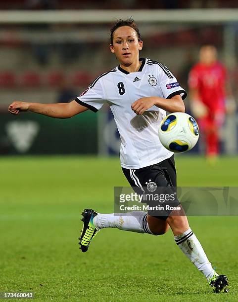 Nadine Kessler of Germany runs with the ball during the UEFA Women's Euro 2013 group B match between Iceland and Germany at Vaxjo Arena on July 14,...
