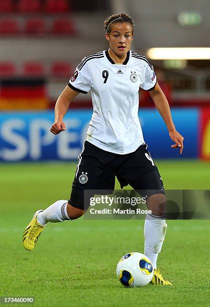 Lena Lotzen of Germany runs with the ball during the UEFA Women's Euro 2013 group B match between Iceland and Germany at Vaxjo Arena on July 14, 2013...