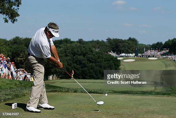 Kenny Perry hits his tee shot on the 18th hole during the final round of the 2013 U.S. Senior Open Championship at Omaha Country Club on July 14,...
