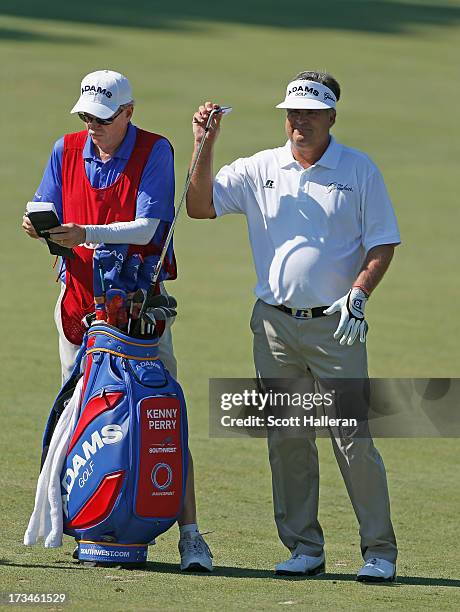 Kenny Perry pulls a club on the 17th hole during the final round of the 2013 U.S. Senior Open Championship at Omaha Country Club on July 14, 2013 in...