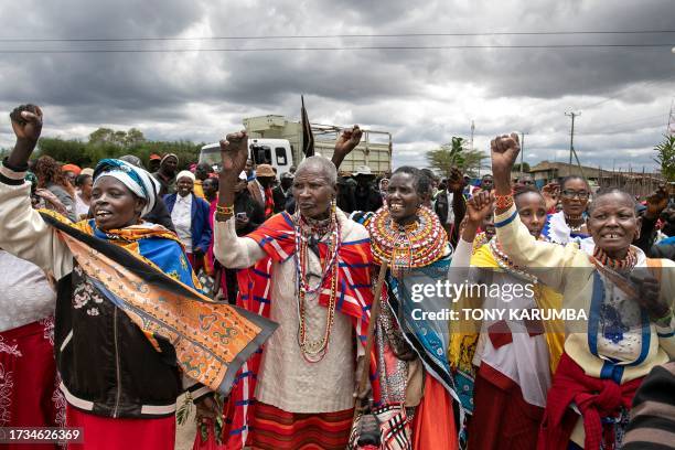 Victims of British Army Training Unit in Kenya training activities and their families hold a demonstration following a meeting with their legal...