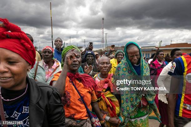 Victims of British Army Training Unit in Kenya training activities and their families hold a demonstration following a meeting with their legal...