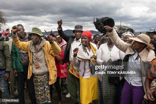 Victims of British Army Training Unit in Kenya training activities and their families hold a demonstration following a meeting with their legal...