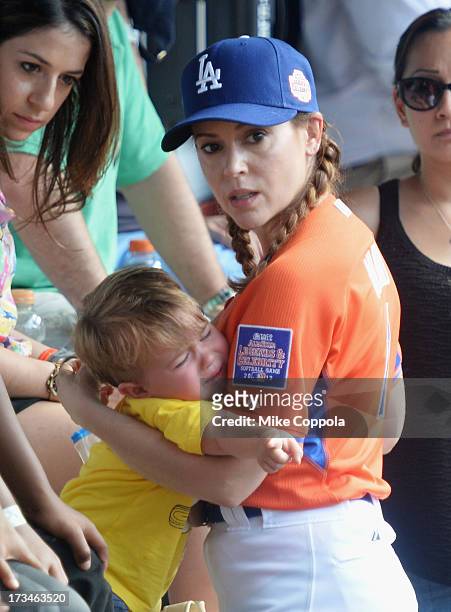 Milo Thomas Bugliari and mother/actress Alyssa Milano attend the Taco Bell All-Star Legends & Celebrity Softball Game at Citi Field on July 14, 2013...