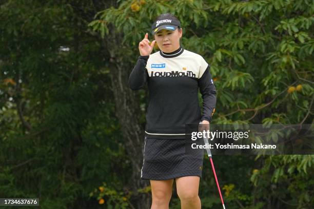 Hiroko Azuma of Japan acknowledges the gallery after the birdie on the 5th green during the second round of Udon-Ken Ladies Golf Tournament at Mannou...