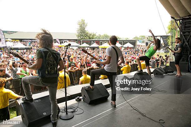 General view of the crowd with the band Oh, Sleeper performing taken from on the stage during the Vans Warped Tour 2013 at Klipsch Music Center on...