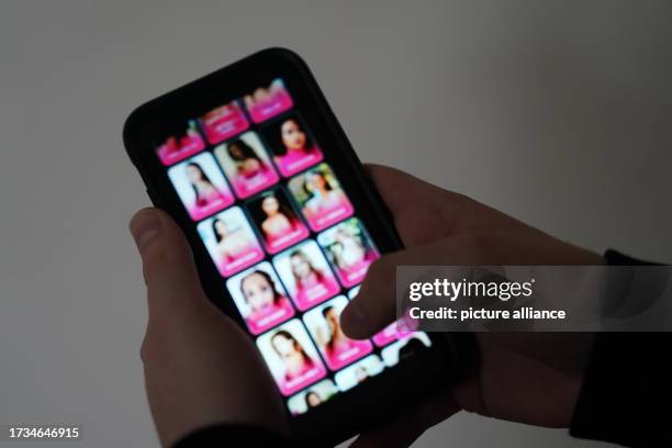 October 2023, Hamburg: ILLUSTRATION - A man is looking at a porn internet site on a smartphone. Photo: Marcus Brandt/dpa