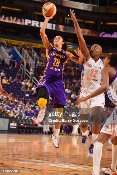 Kristi Toliver of the Los Angeles Sparks shoots against Charde Houston of the Phoenix Mercury on July 14, 2013 at U.S. Airways Center in Phoenix,...